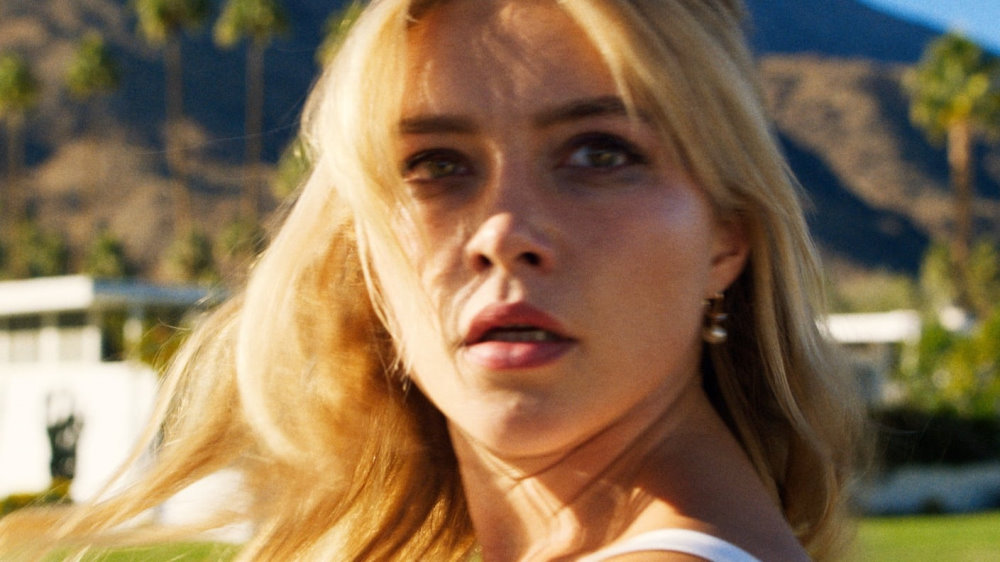 A promotional still showing Florence Pugh making a confused and terribly concerned face at the camera